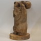 Wooden bear figure with kettlebells